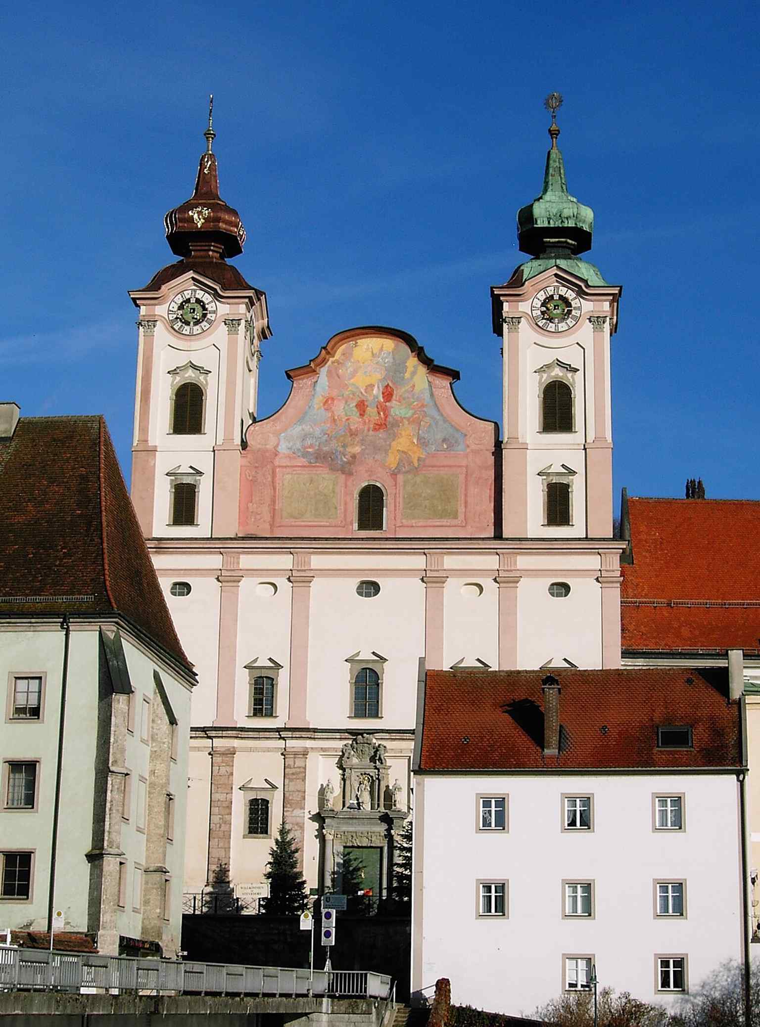 The church seen from Michaelerplatz, emphasizing its elevated position and fortress-like presence at the edge of the historic district.