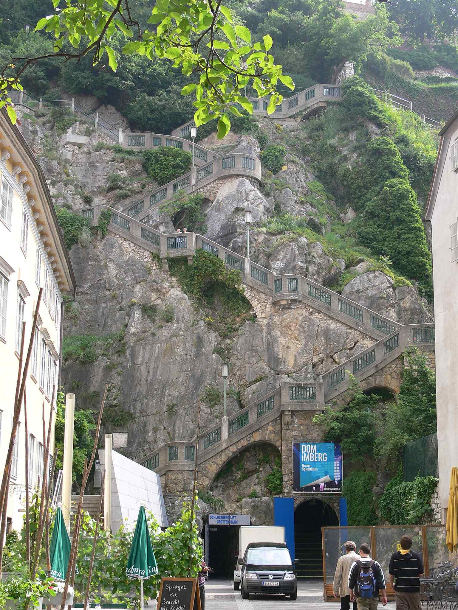 The staircase and Schlossberglift entrance on Schloßbergplatz, where today visitors access the mountain, rutsche, and the famous underground route.