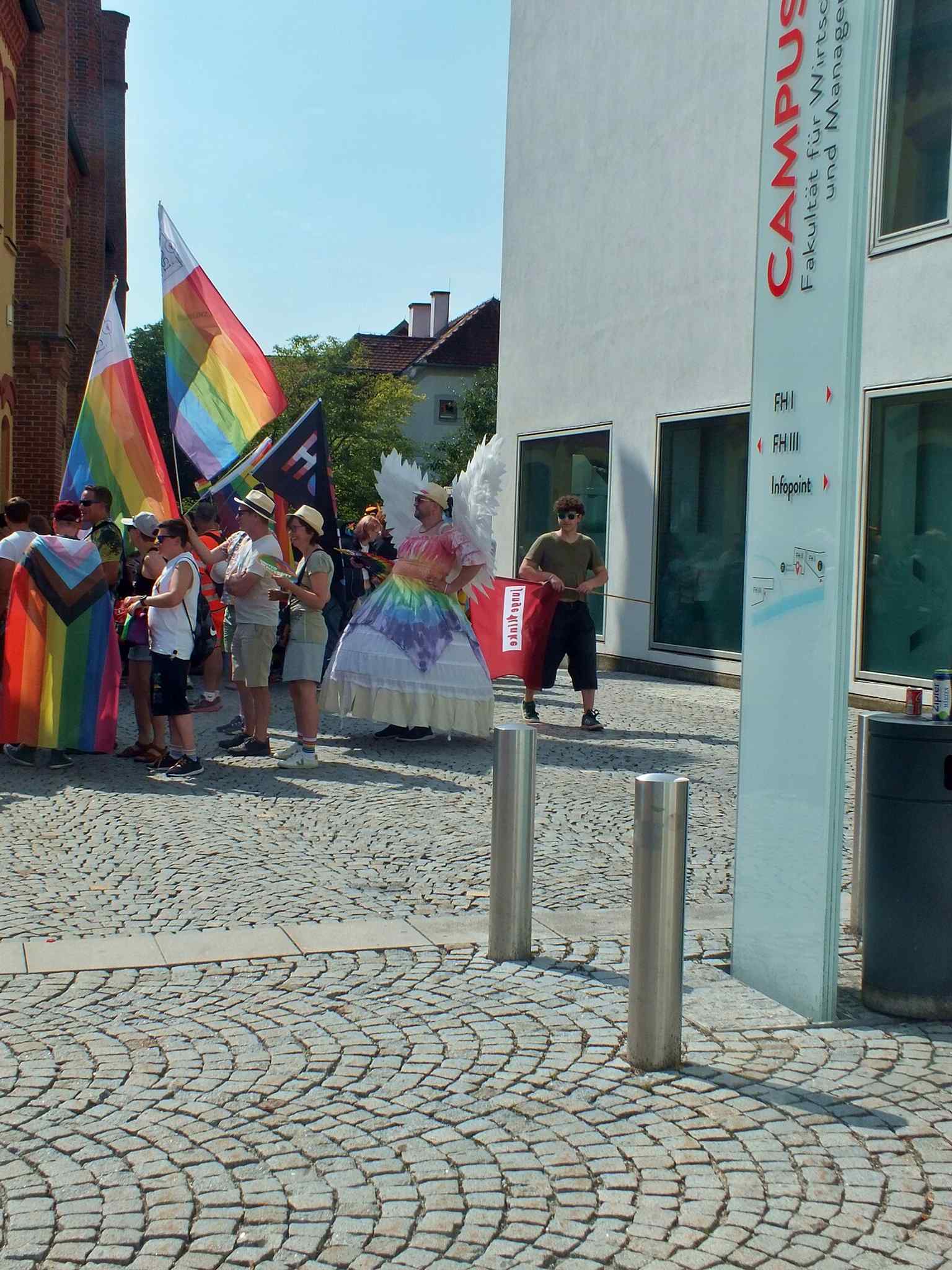 The parade ending at Museum Arbeitswelt, a strong image of the museum as a destination for public assembly and discussion.