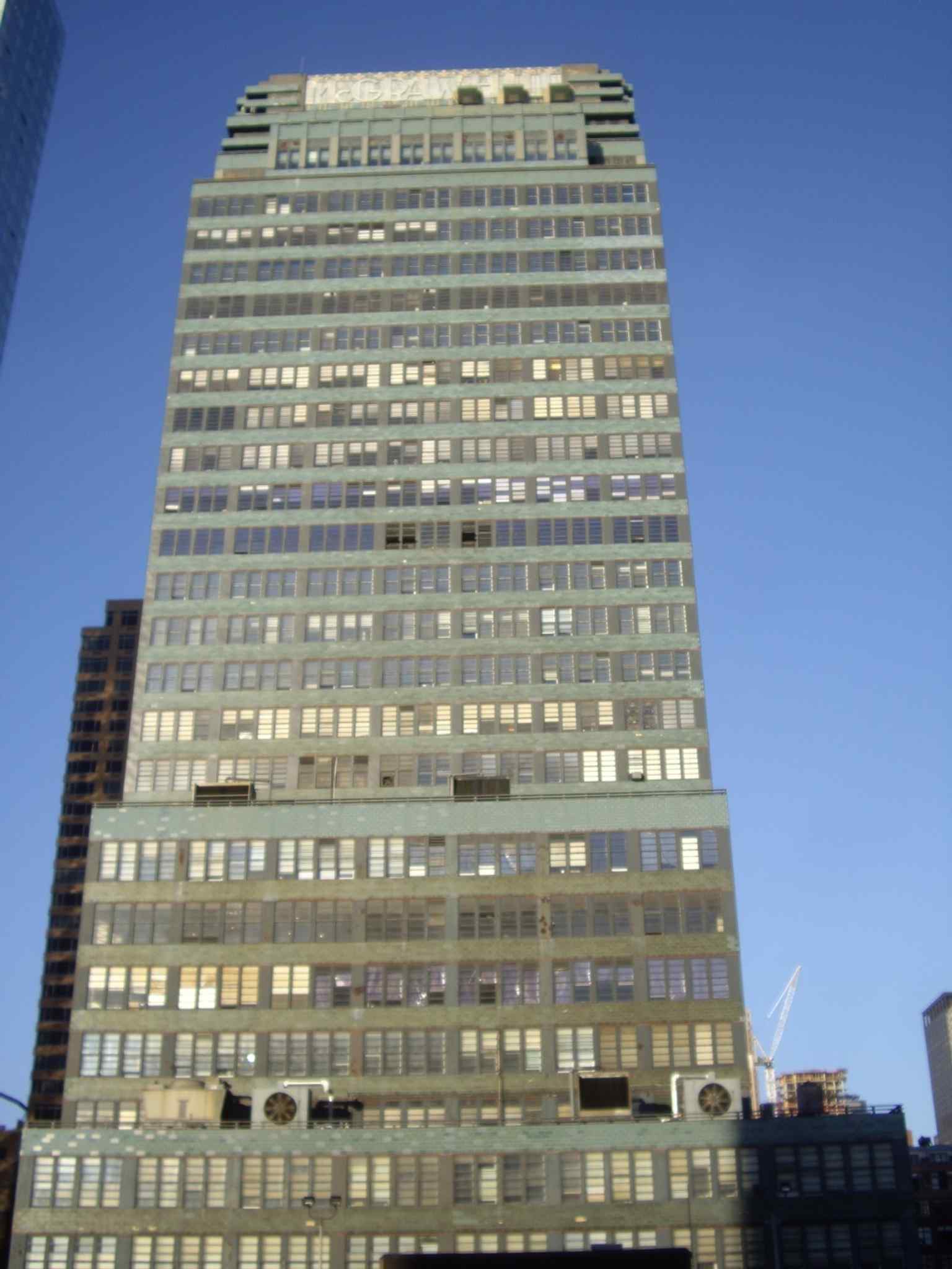 This view captures the distinctive blue-green terracotta facade and horizontal emphasis that was controversial at the time of its completion in 1931, but later recognized as an early example of the International Style.