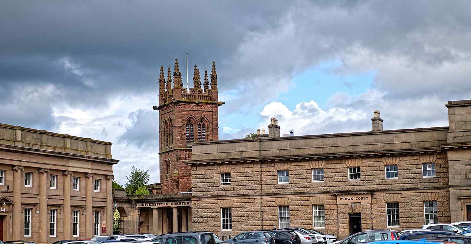 A clear view from Castle Square of the old church beside Chester Castle, emphasizing its close relationship to the castle and hilltop setting.