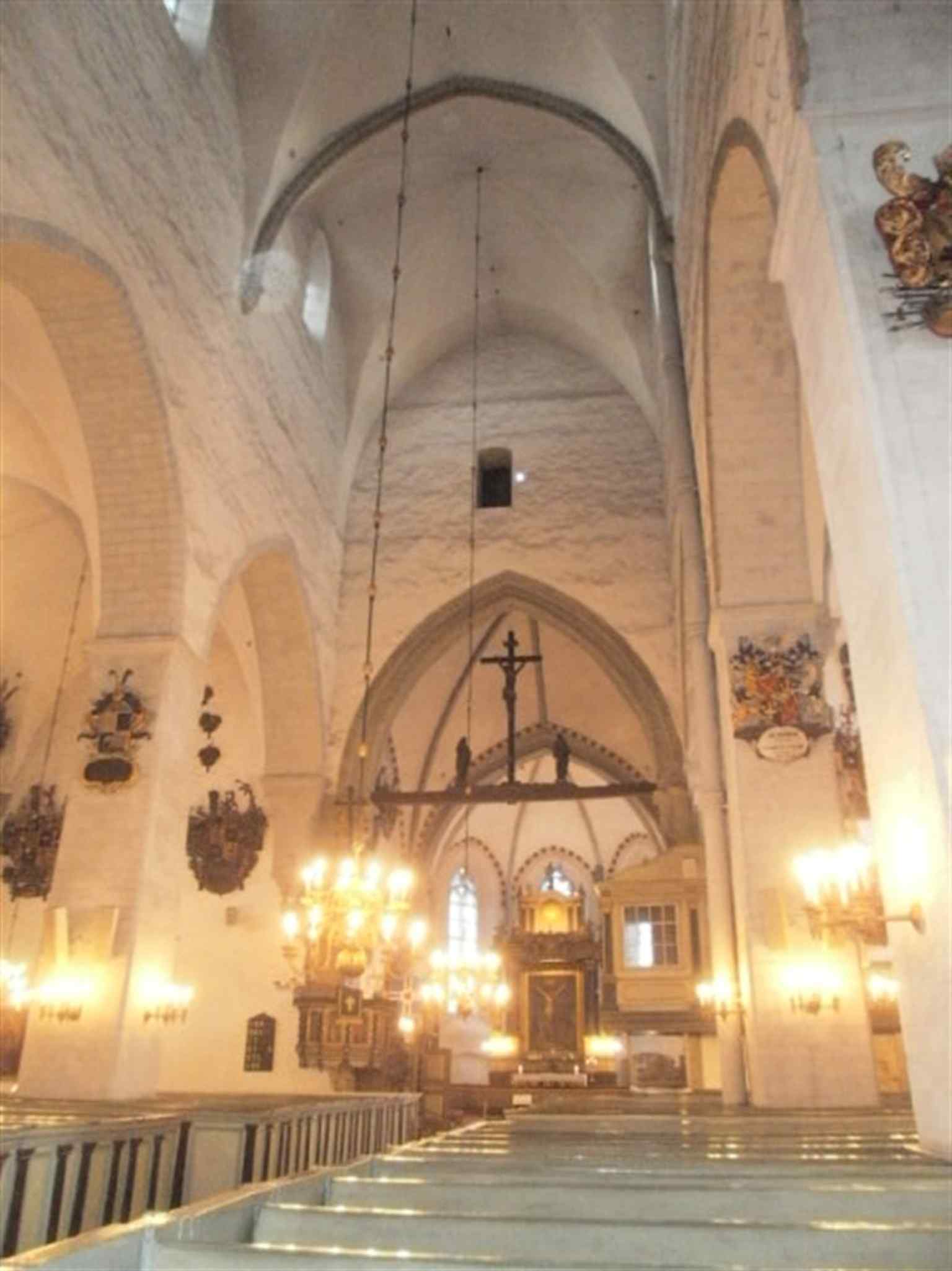 Looking down the central nave toward the choir, where centuries of burial monuments line the cathedral’s sacred interior.