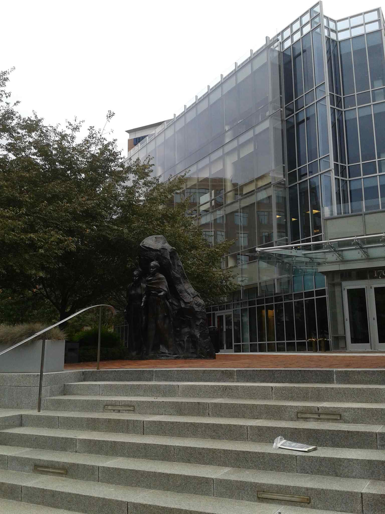 The bronze sculpture by artist Erik Blome depicts Mary and Emily Edmonson, who were imprisoned here after the Pearl incident and later freed through the efforts of Reverend Henry Ward Beecher.