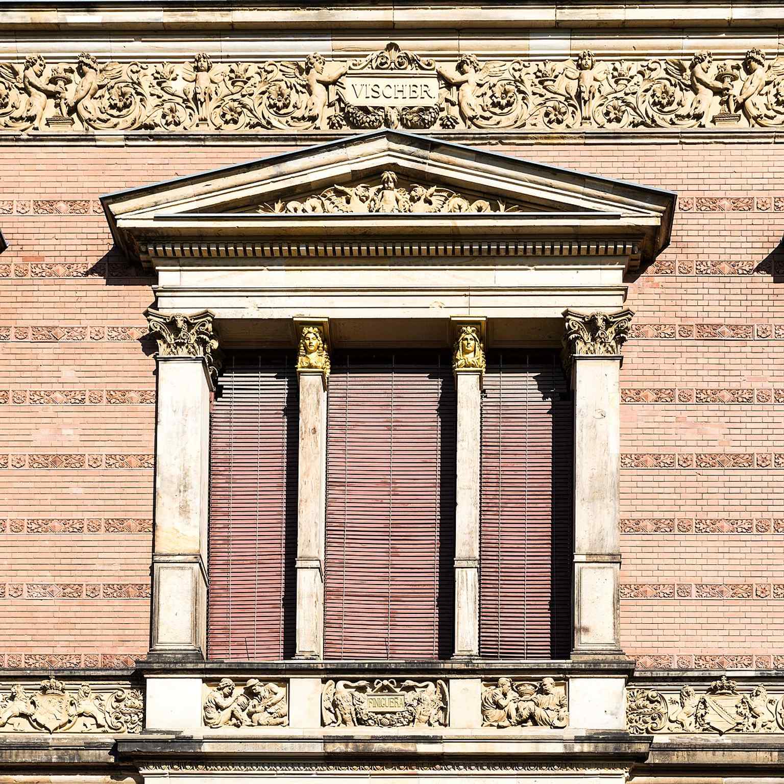 Window and relief detail from the monument’s exterior, capturing the craftsmanship of the 19th-century façade.