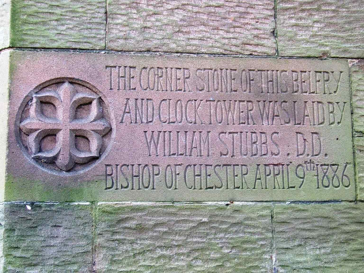 A dedication tablet near the bell tower, a small but important trace of the church’s later parish history after its cathedral status was lost.