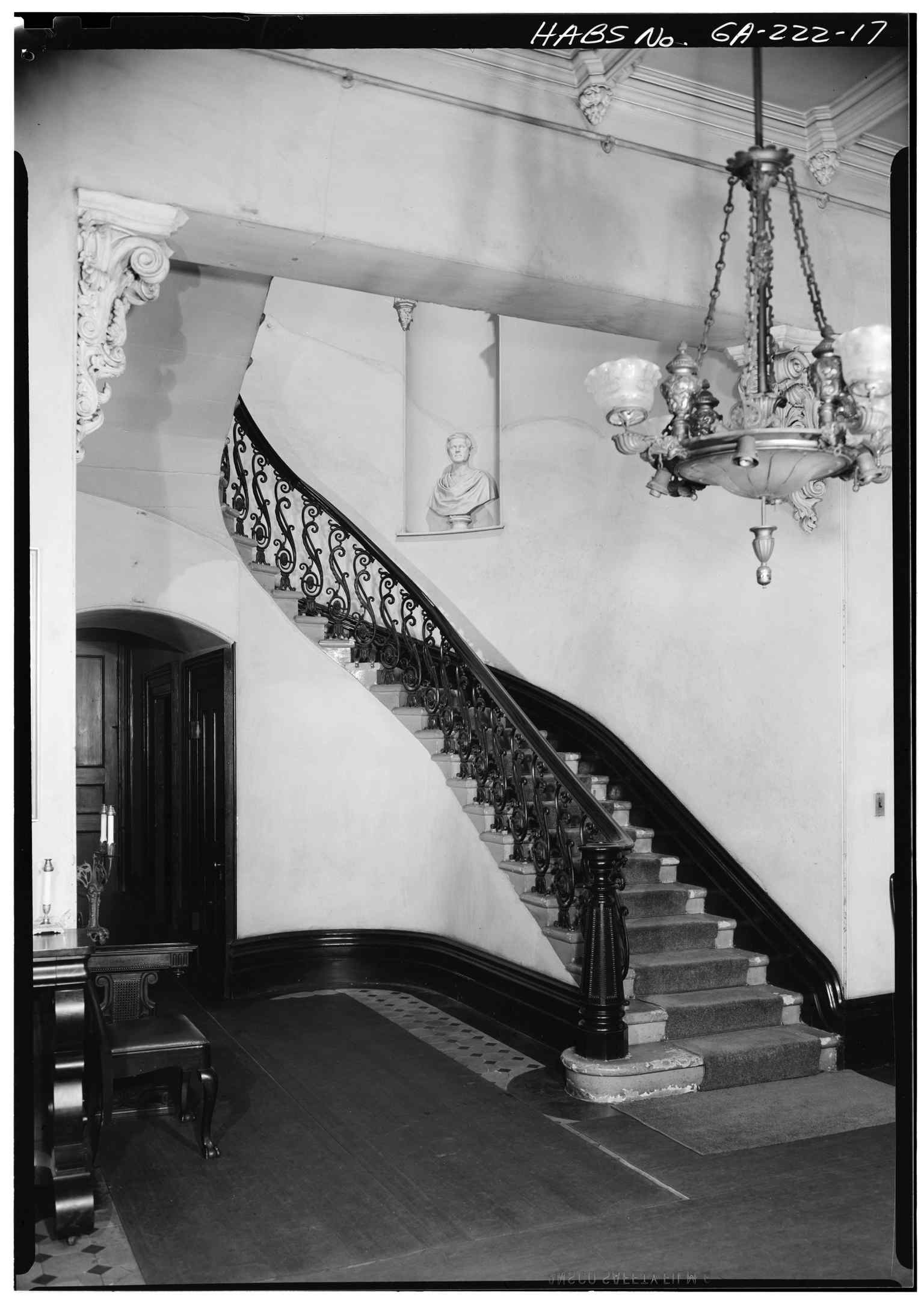 Features the house's magnificent freestanding staircase, a highlight of its original interior ironwork and craftsmanship from 1853.