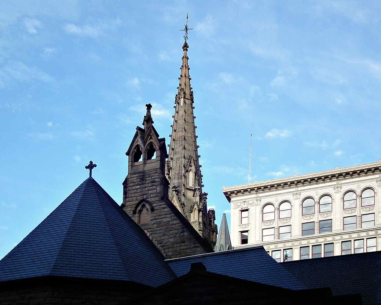 The distinctive central steeple of Trinity Cathedral, a hallmark of the English Gothic style favored by mid-Victorian Episcopalians when the church was designed in 1870-1871.