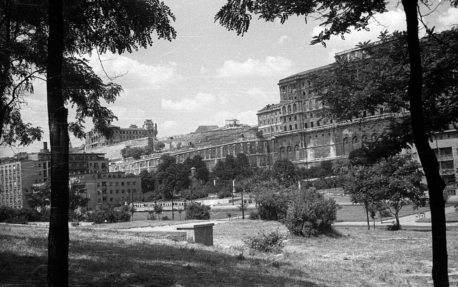 A 1959 view of Buda Castle from Tabán Park, featuring the heavily ruined Archduke Joseph's Palace (left), which stood in disrepair for over two decades after the war.