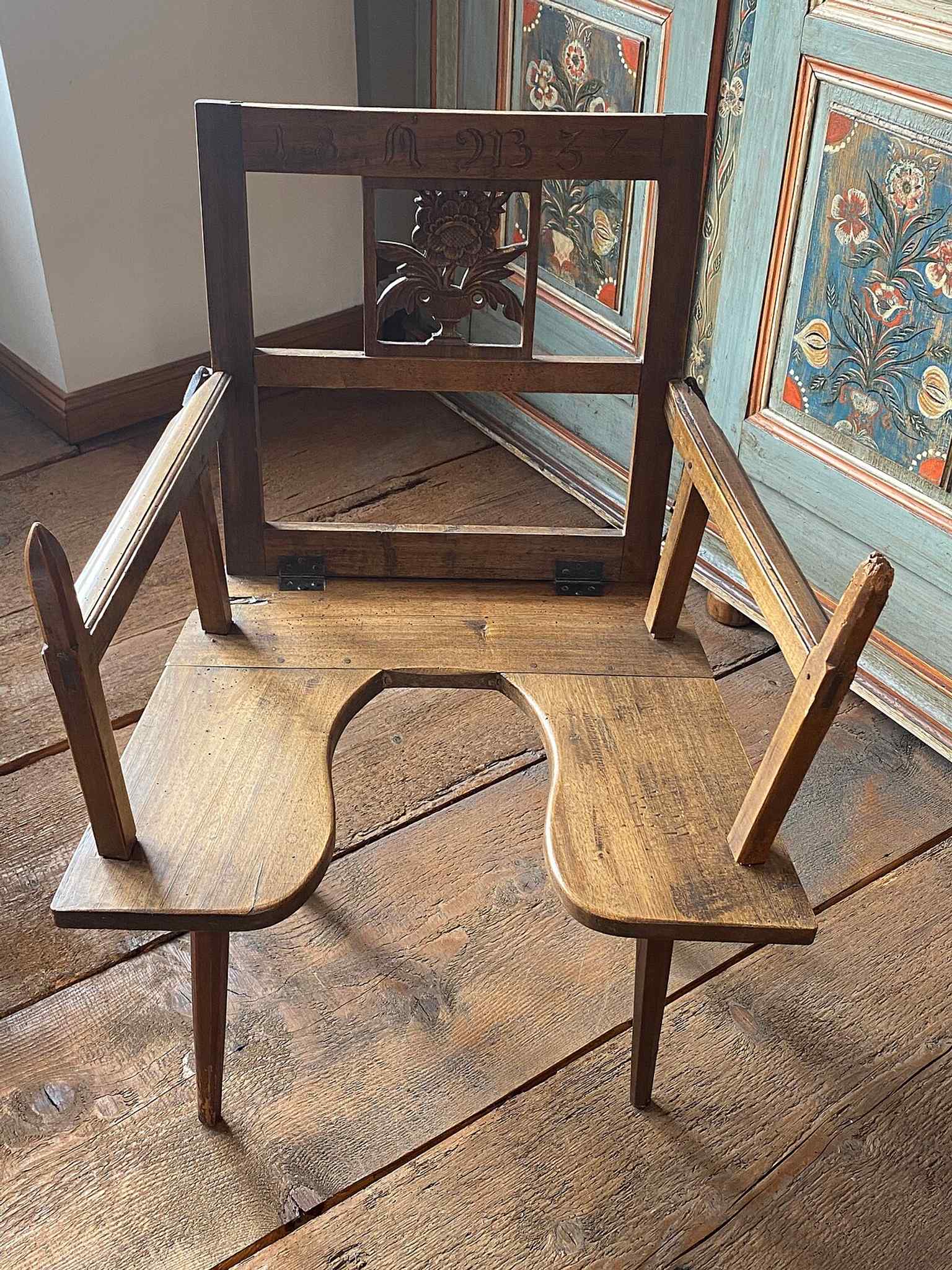 A childbirth chair, illustrating the museum’s section on life events, from birth and baptism to marriage and death.