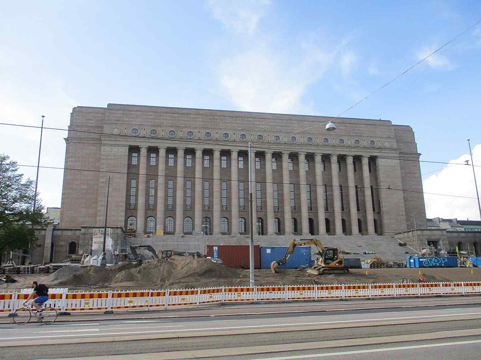 A crisp post-renovation view of Parliament House — the 2017 reopening marked the return of Finland’s legislature to its restored national landmark.