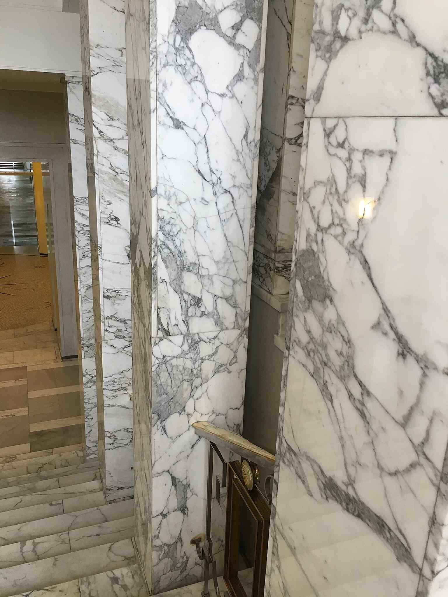 Another interior angle from the same series, useful for showing the everyday working spaces hidden inside the monumental shell.