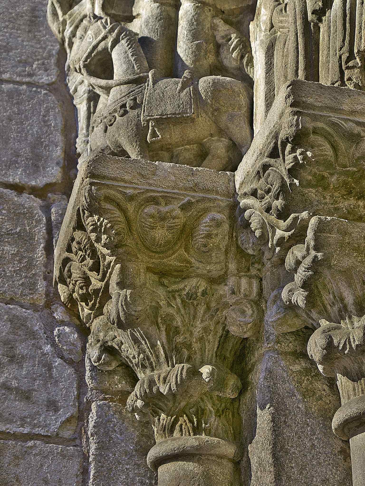 A detail from the Chapel of Corticela's Romanesque door, showing the horses of the Magi, part of the tympanum's Adoration of the Magi scene.
