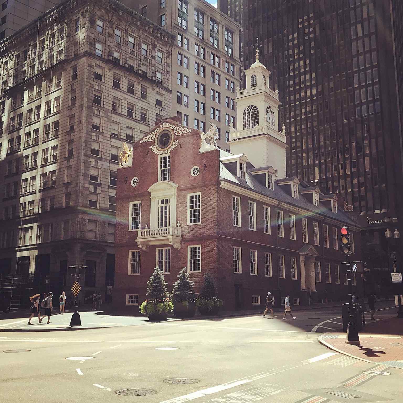 The Boston Massacre memorial marker stands just east of the Old State House, linking the building directly to one of the city’s defining Revolutionary events.