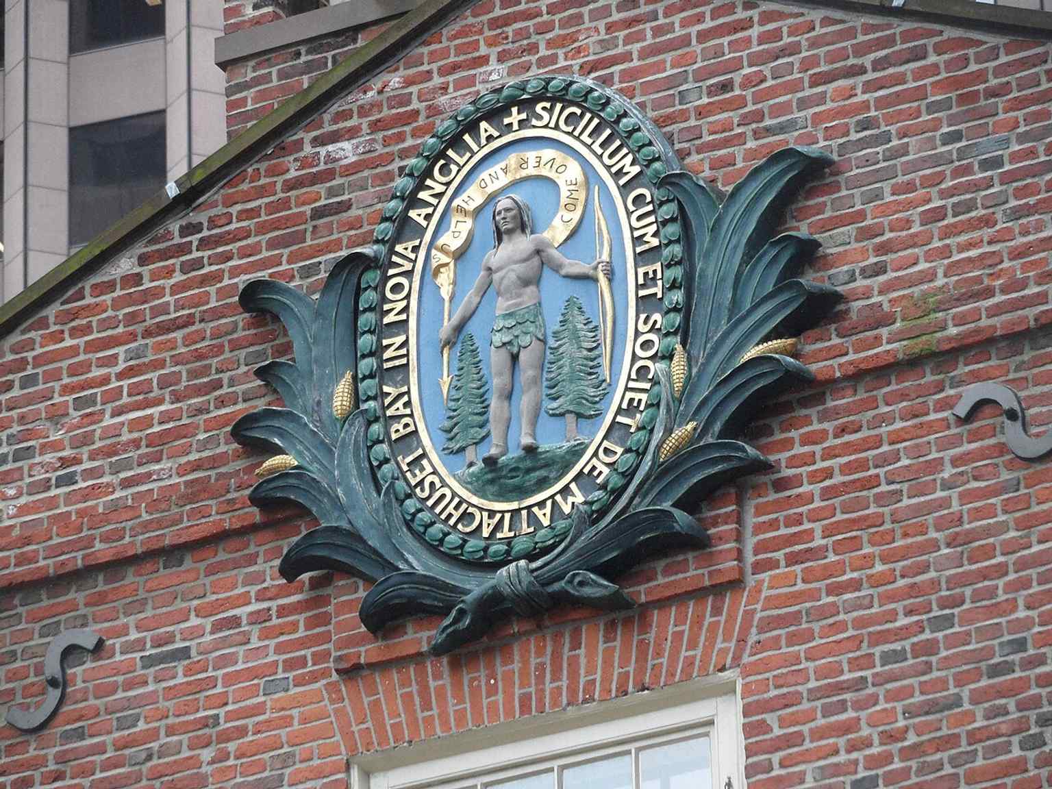 A close look at the Massachusetts state seal on the Old State House, reflecting the building’s later political identity.