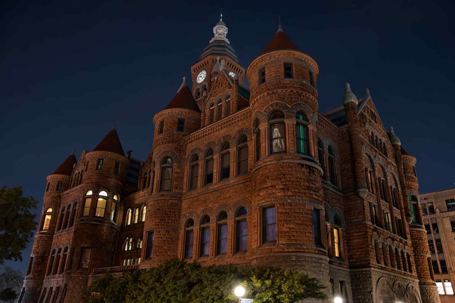 A clear full view of the 1892 Old Red Courthouse, the red sandstone landmark that later became the Old Red Museum and is now returning to justice use.