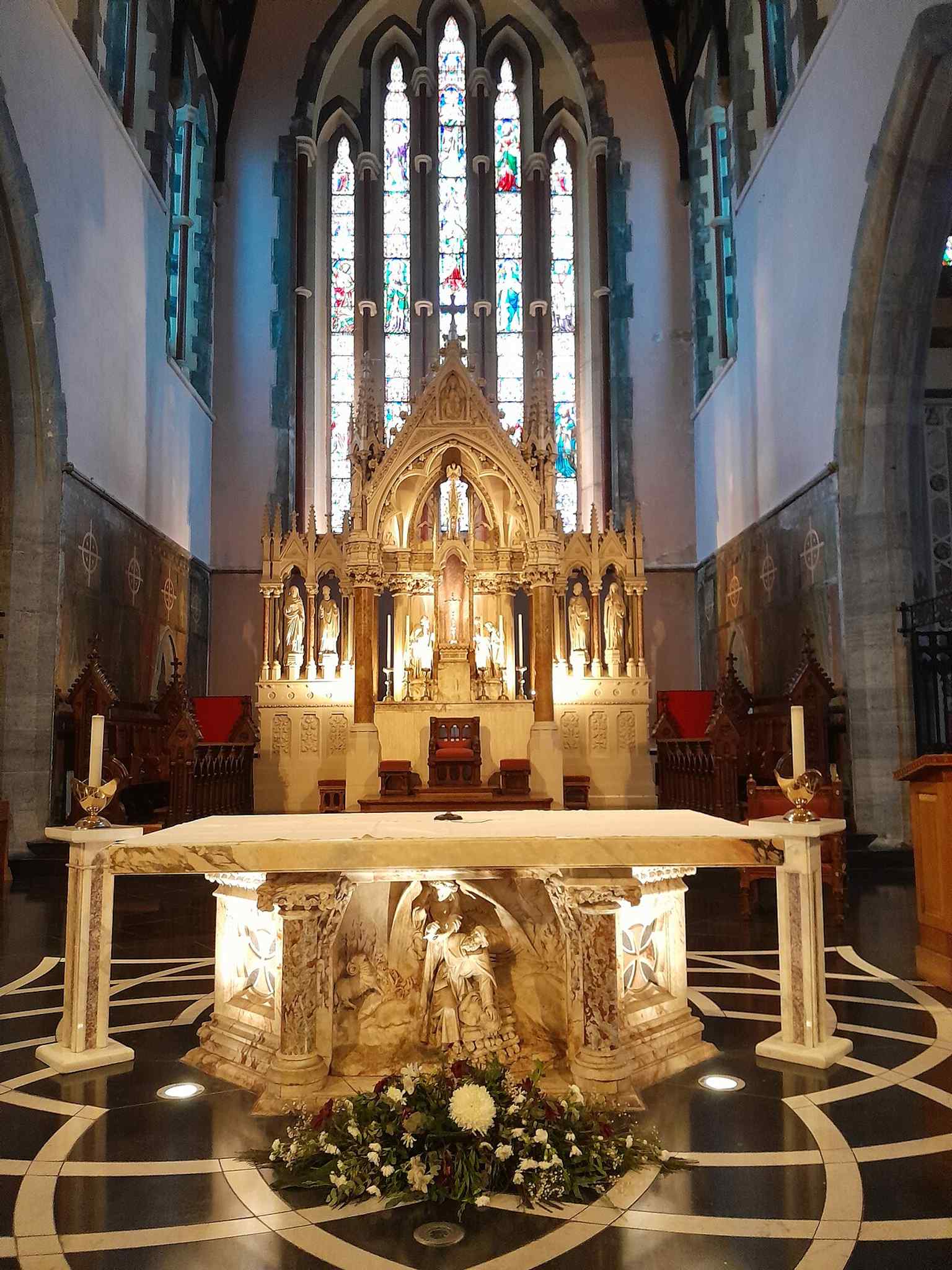 The cathedral's nave, with original pews and floor tiles that have survived since the building's consecration in 1894, offering a glimpse into its rich history.
