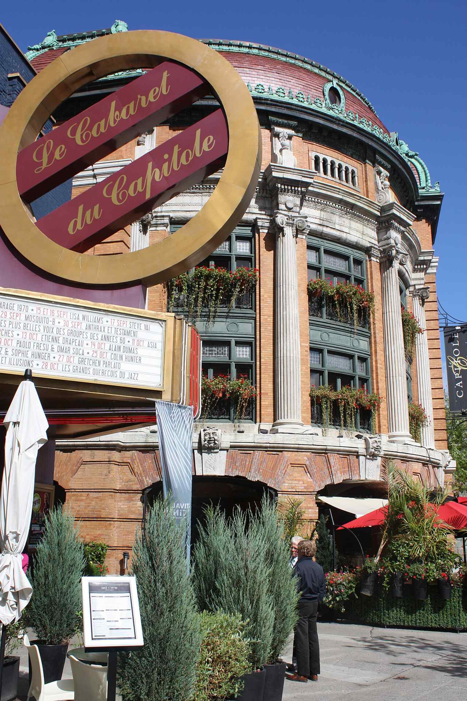 Another clear exterior angle highlighting the building’s curved streetfront and restored historic character.
