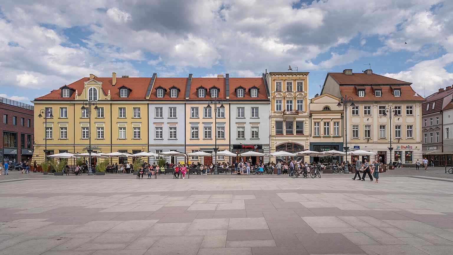 The east side of Old Market Square, where the rebuilt 20th-century frontage stands over a place shaped by wartime destruction and postwar reconstruction.