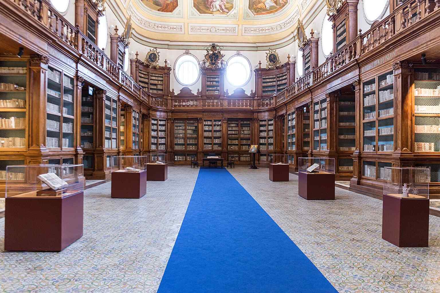 A broad view of the Sala Vaccarini that highlights how the old monastic library survives almost intact inside the monastery.
