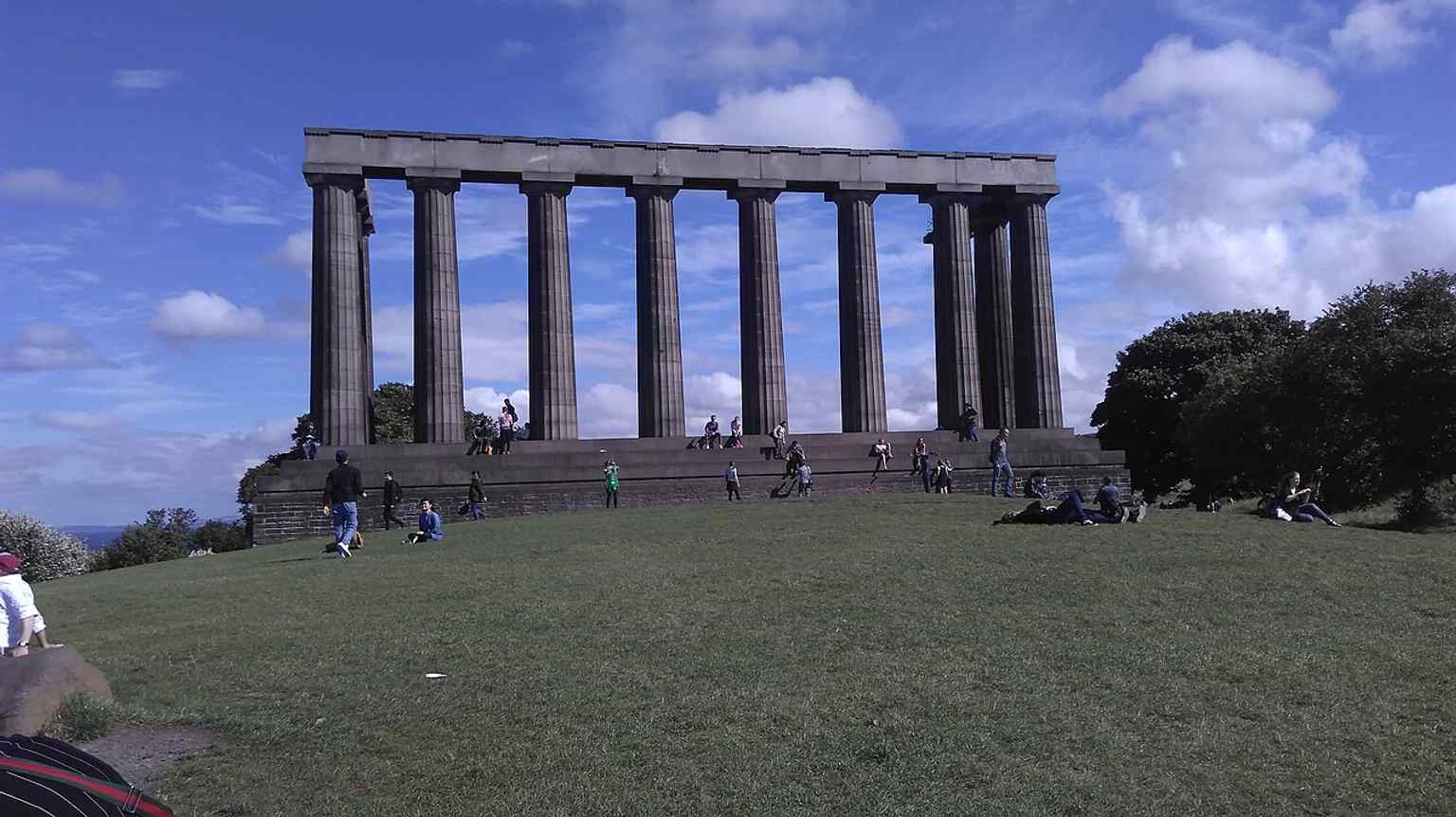 A straightforward full view of the National Monument of Scotland, ideal for introducing the landmark itself.
