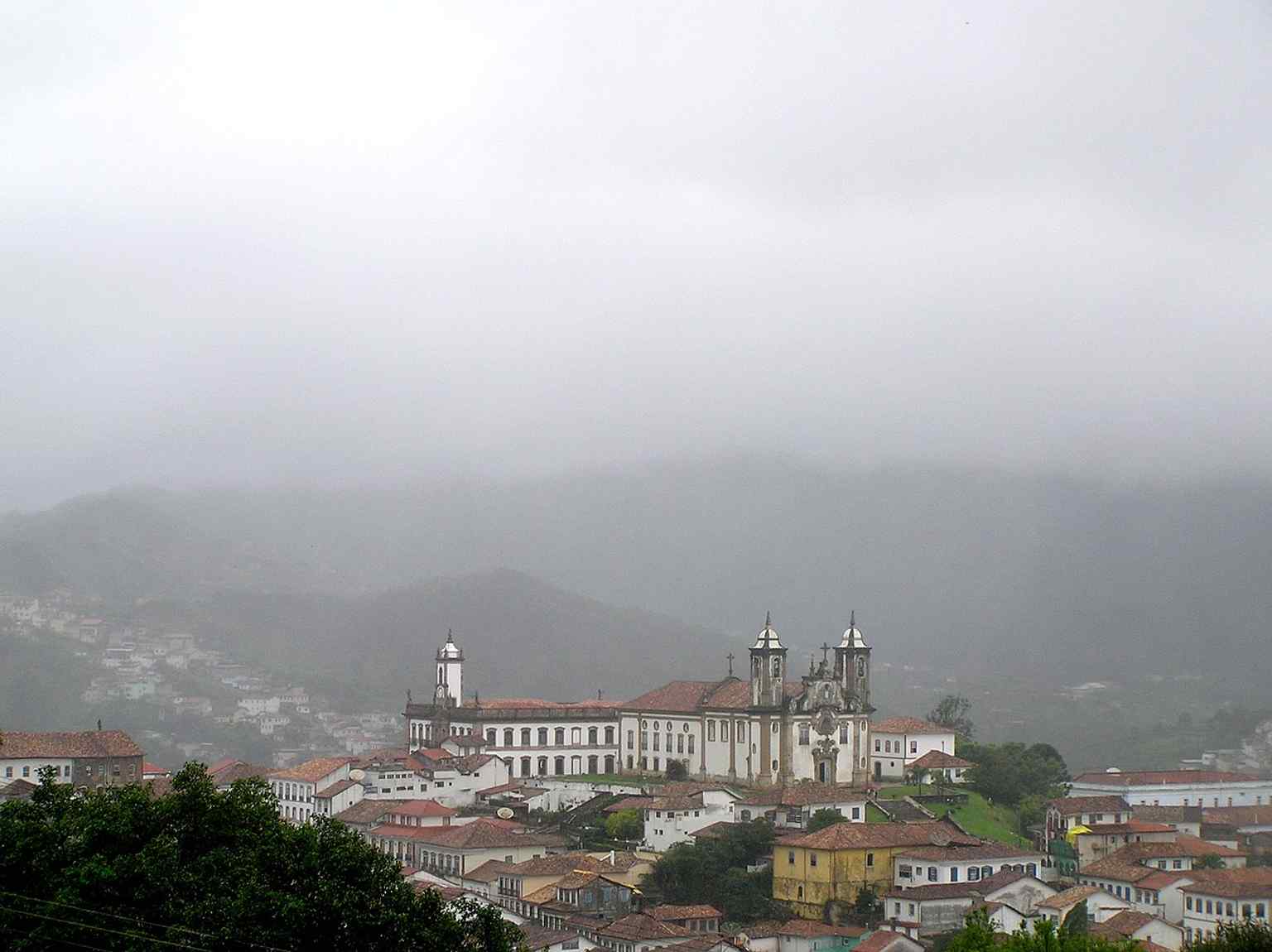 A historic city view where Carmo Church appears in the urban skyline, underscoring its long-standing place in Porto’s center.