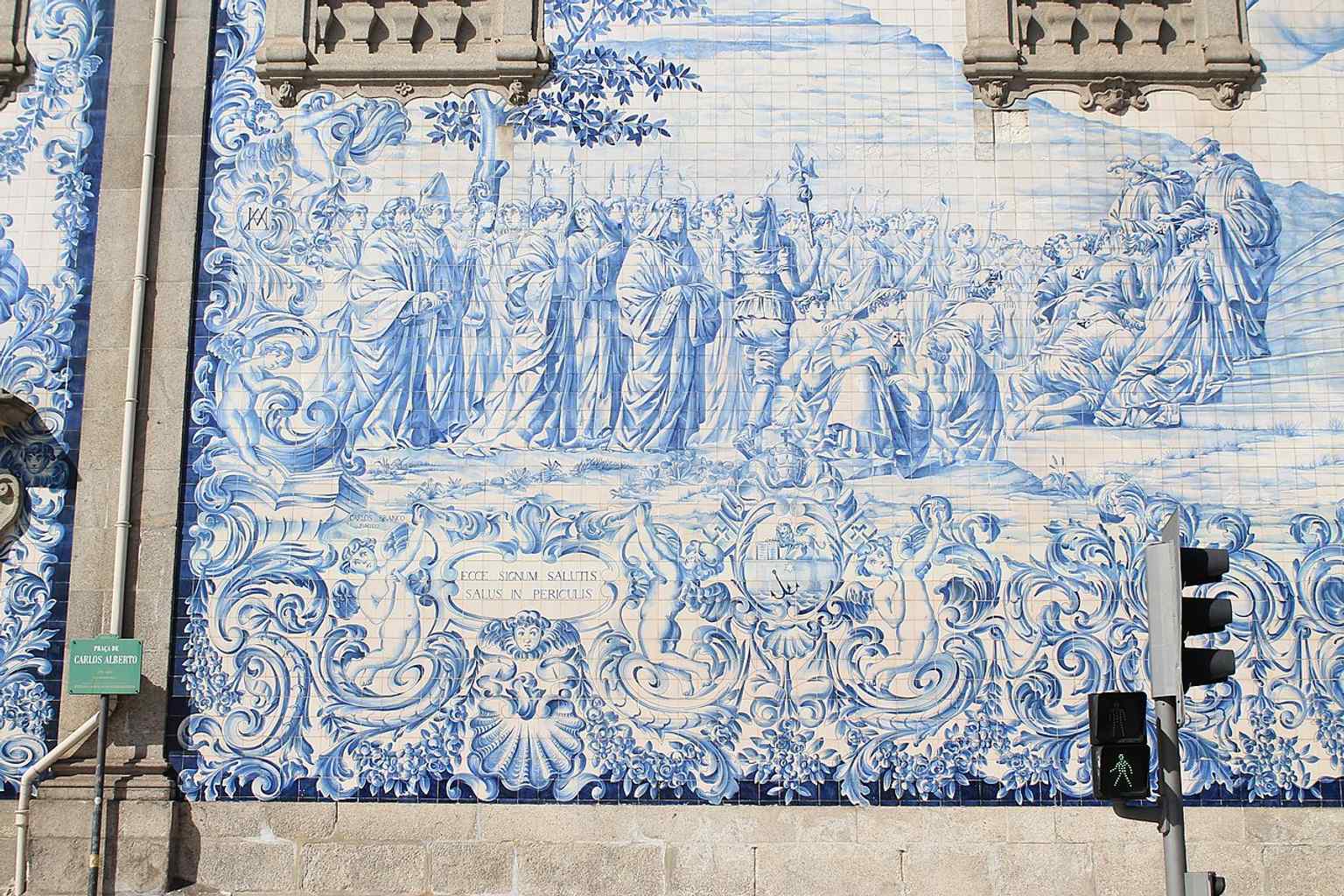 The blue-and-white azulejo wall on the church side captures the 1912 tile panel that tells stories of the Carmelite order and Mount Carmel.