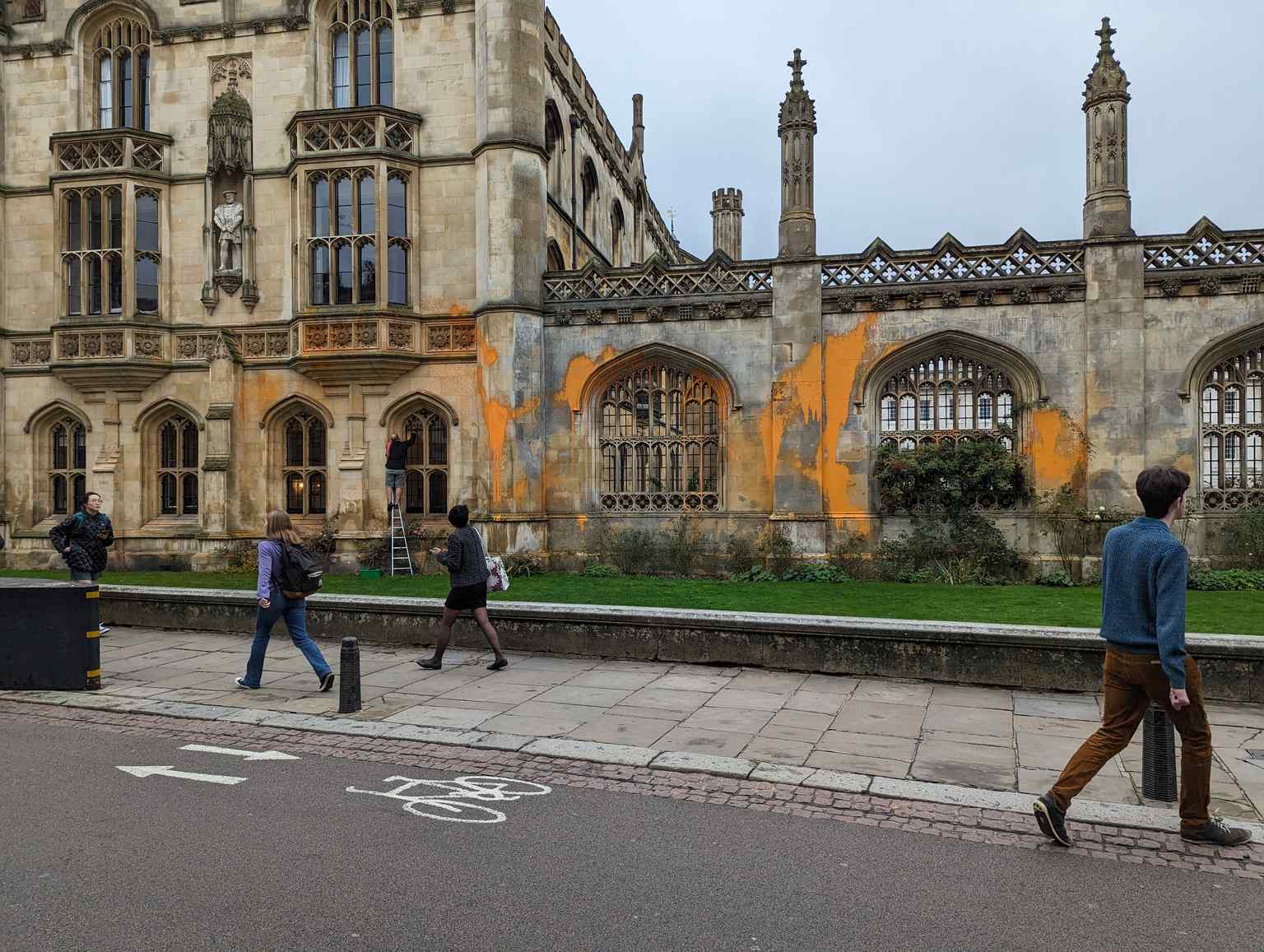 This image shows King's College being cleaned after a 2023 protest, highlighting the college's ongoing 'reputation for radical political activity' among its students.
