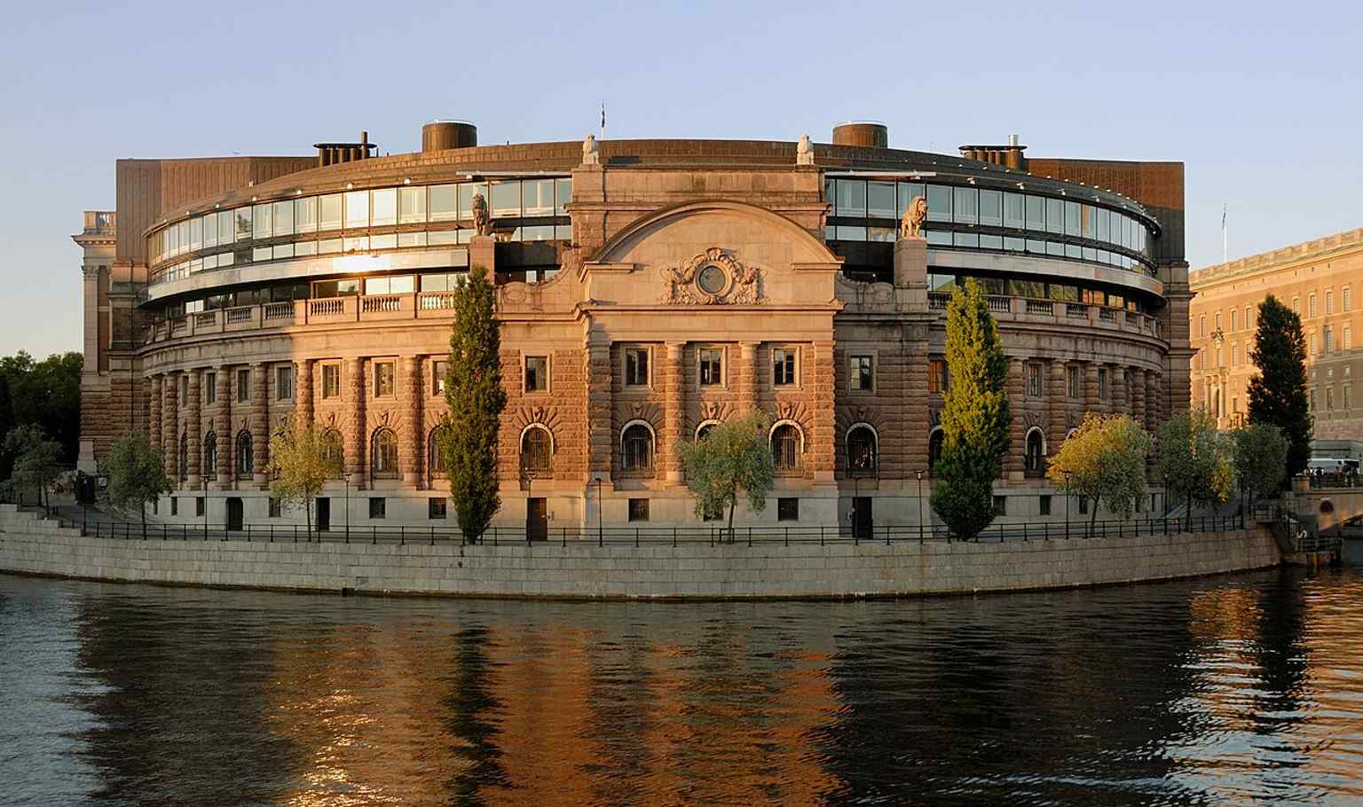 A closer exterior view of the Riksdag building, useful for discussing the façade details and the decorative sculpture program.