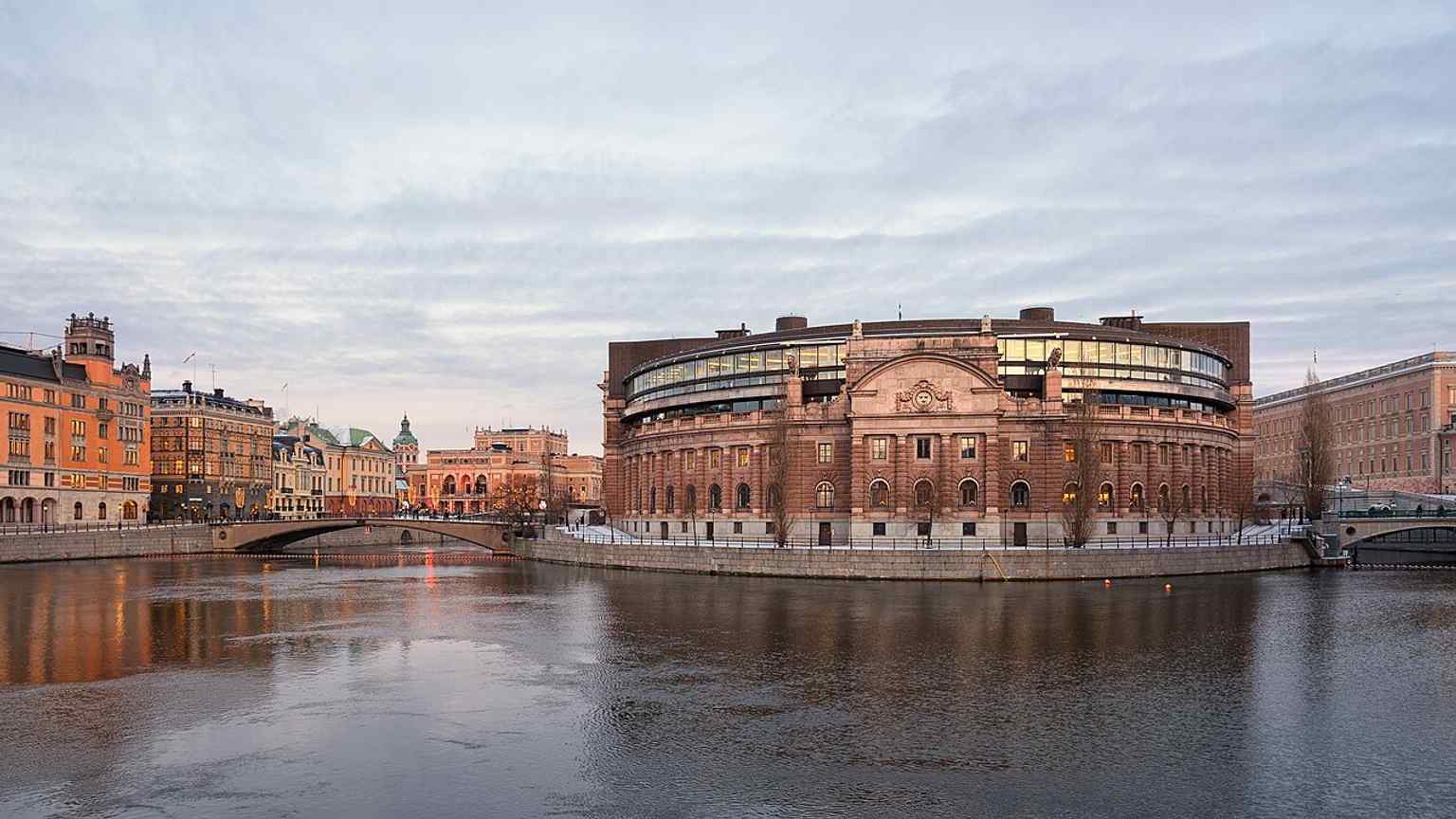 The parliament house with the Royal Swedish Opera in the background gives a broader Stockholm context and shows the building’s urban setting.