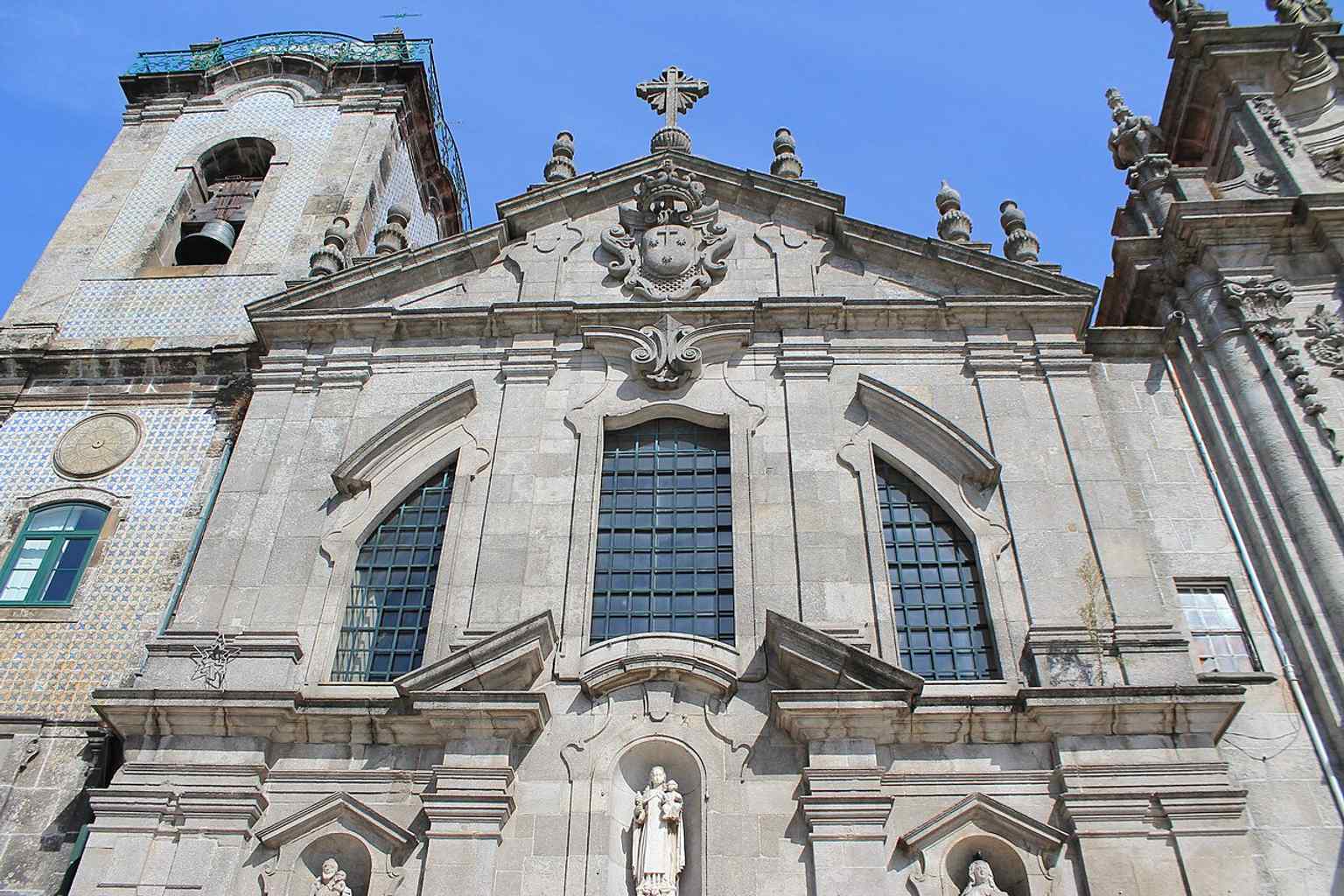 Front view of the Carmelite Church in Porto, showing the granite façade that forms part of the famous paired church complex beside Igreja do Carmo.