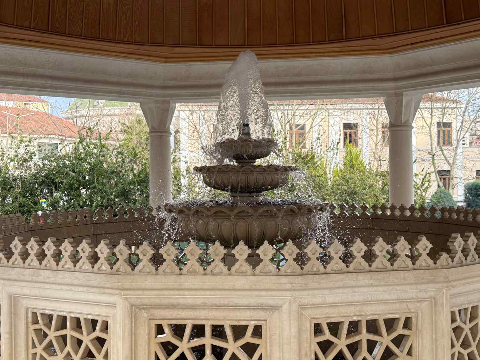 An ablution fountain outside the mosque, a traditional feature for ritual purification before prayer, emphasizing the 'Namazgjah' or 'place of prayer' concept.