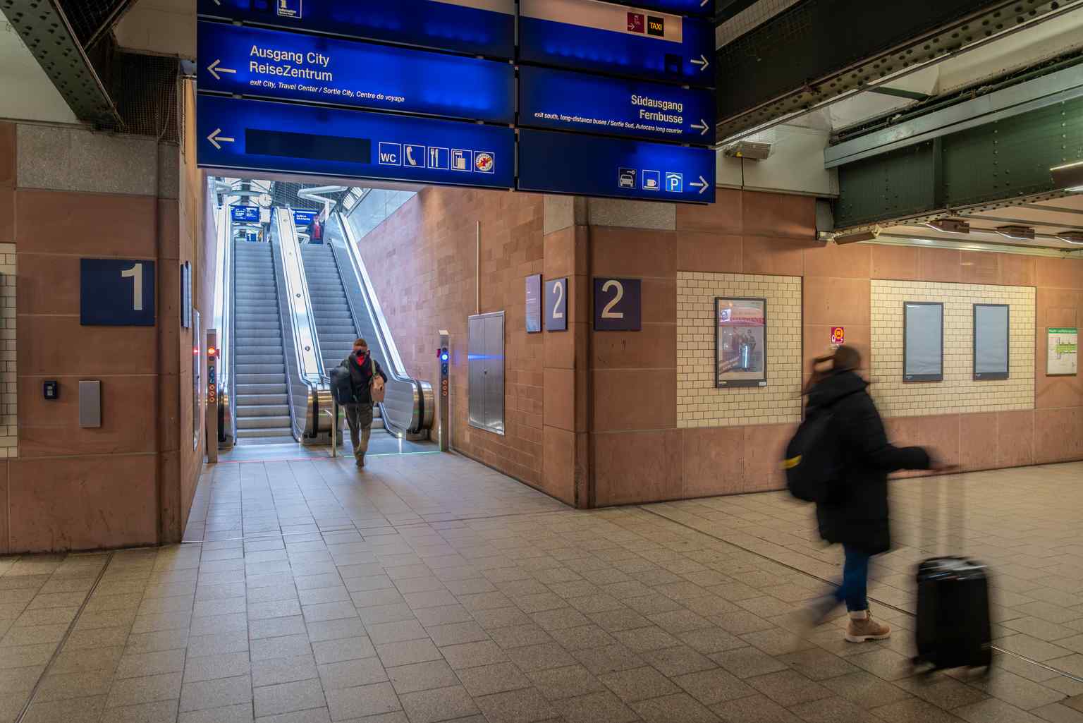 The majestic sandstone facade of Karlsruhe Central Station, completed in 1913, embodies August Stürzenacker's design, a blend of Historism and geometric Art Nouveau that was chosen over a more radical avant-garde proposal.