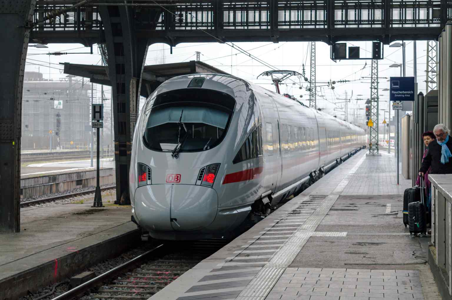An ICE T high-speed train departing from Karlsruhe, representing the long-distance connections to major German cities like Berlin, Hamburg, and Munich that serve the station.
