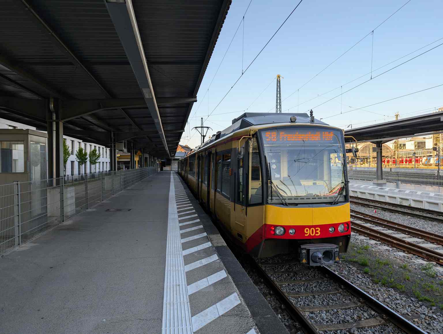 A modern AVG Stadtbahn on line S8, one of the many Stadtbahn lines connecting Karlsruhe Central Station to the surrounding region, demonstrating its function as a central node for regional transport.