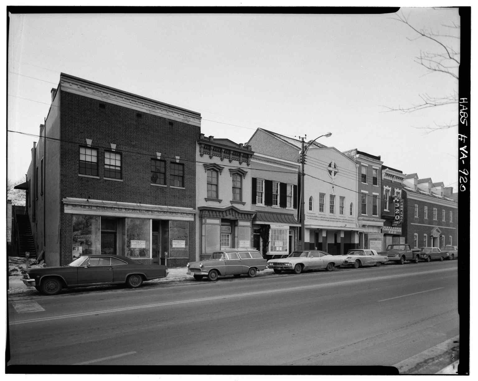 A 1933 street view of 300-320 King Street, showcasing the Federal style townhouses that characterize Alexandria's late 18th and early 19th-century urban architecture.