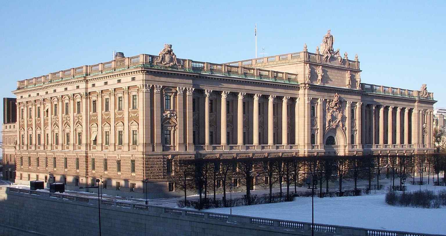 A clear front view of Riksdagshuset in central Stockholm, the seat of Sweden’s parliament since the building opened in 1905.