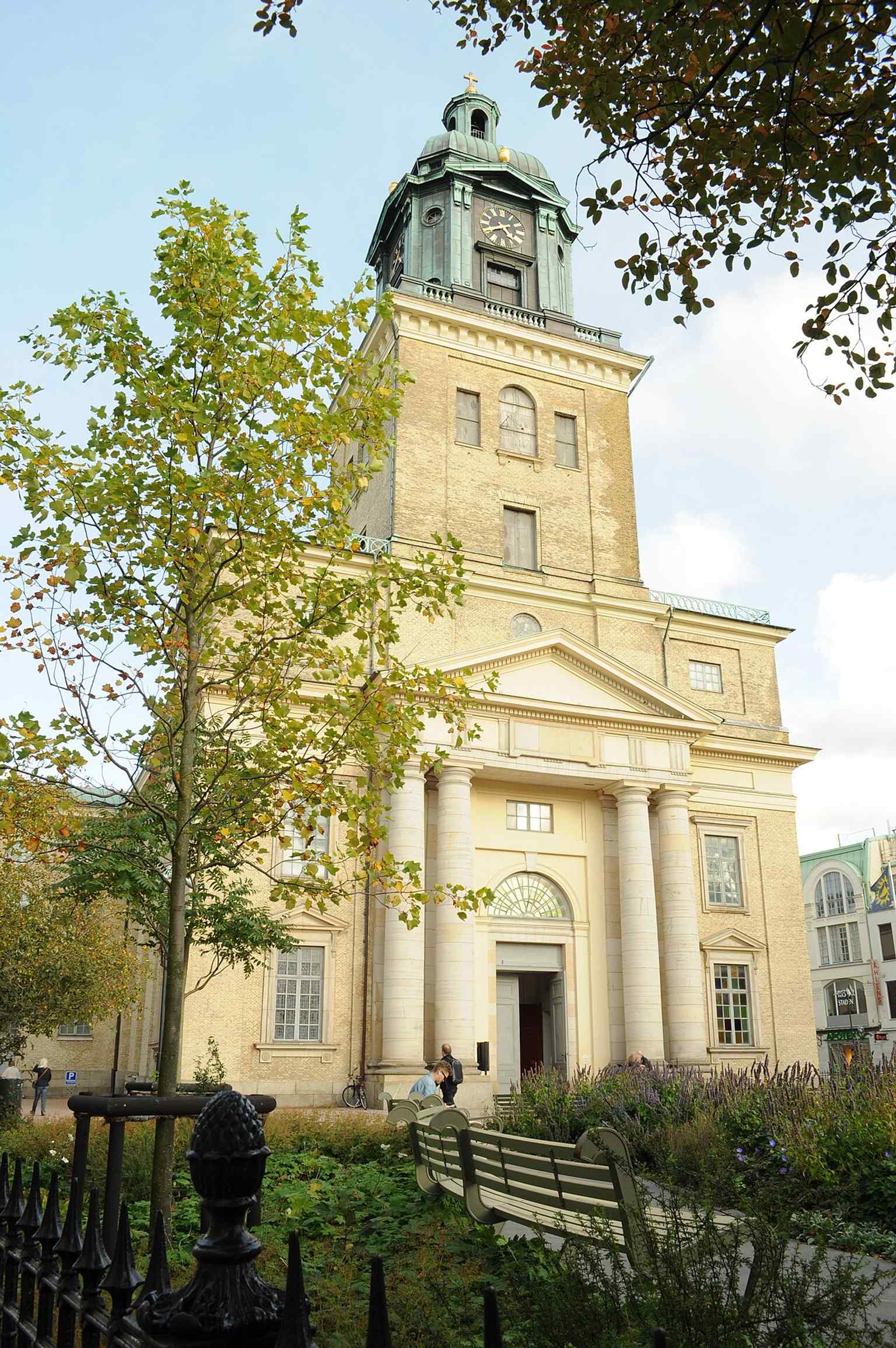 The main portal at the west end of the cathedral, framed by four Doric columns, exemplifies the classical architectural style.