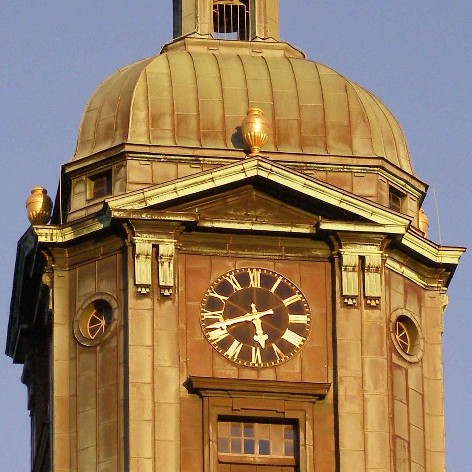 A close-up of the tower clock, which was inaugurated in 1825 along with the completed tower of the third cathedral.