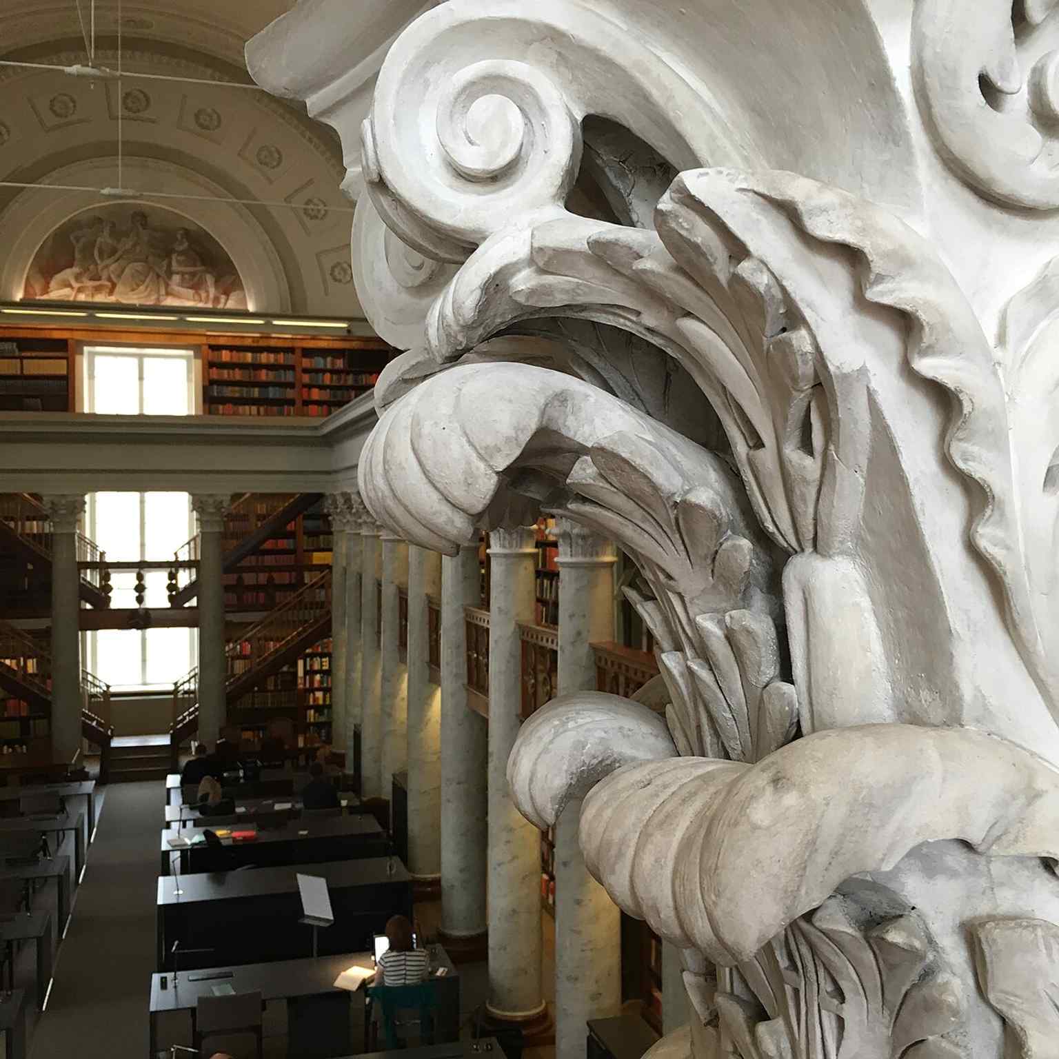An interior detail from the historic building, useful for highlighting the preserved decorative craftsmanship of the renovated library.