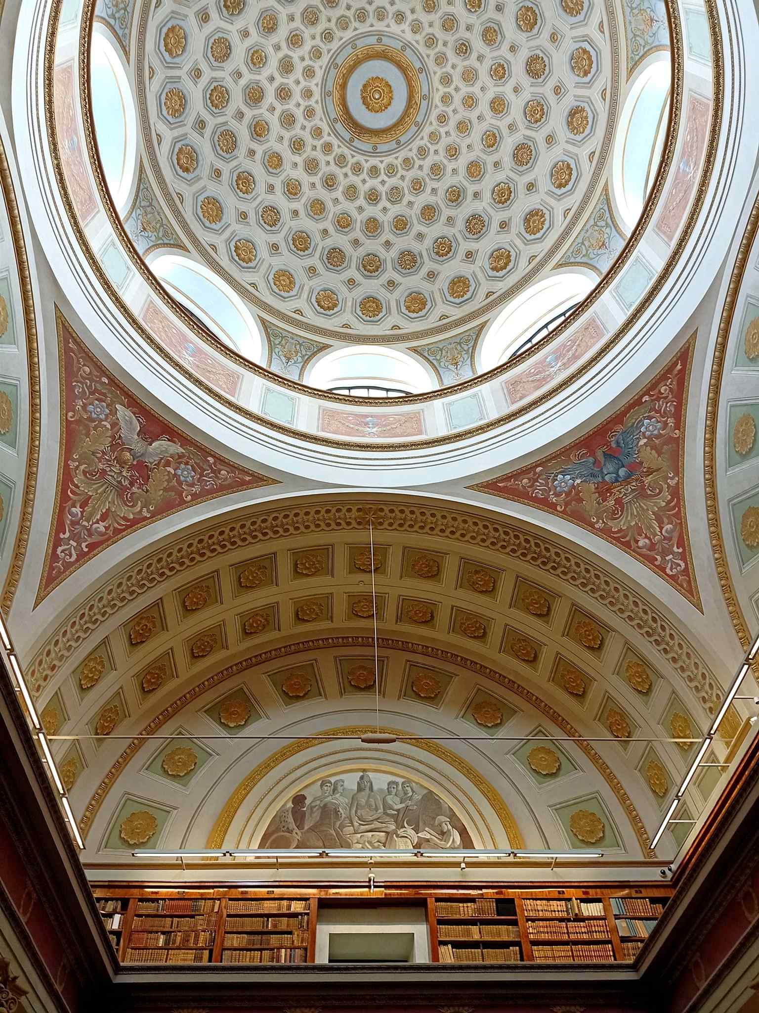 An upward view into the dome, emphasizing the building’s monumental cupola and the architectural drama of the central hall.