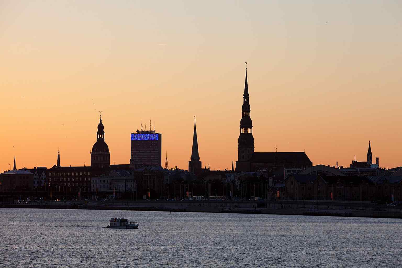A sweeping panorama of St. Peter’s Church rising over Riga’s Old Town, showing why its 123.5-meter tower was once the city’s tallest landmark.