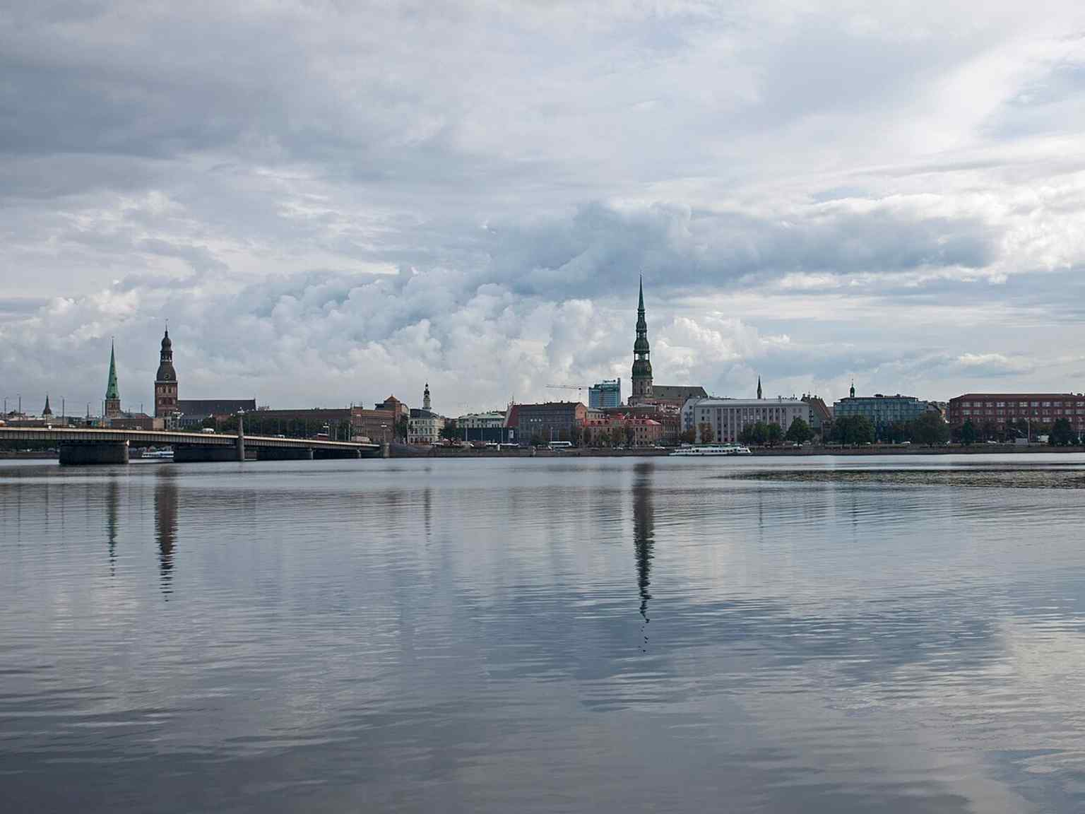 A sweeping view of Old Riga with St. Peter’s Church, the Dome Cathedral, and St. James’s Cathedral — the historic skyline that defines Vecrīga.