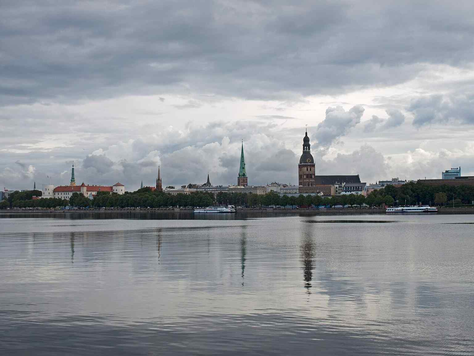 Panorama from the Stone Bridge showing the Dome Cathedral and Riga Castle, linking the Old Town to the Daugava riverfront it grew along.