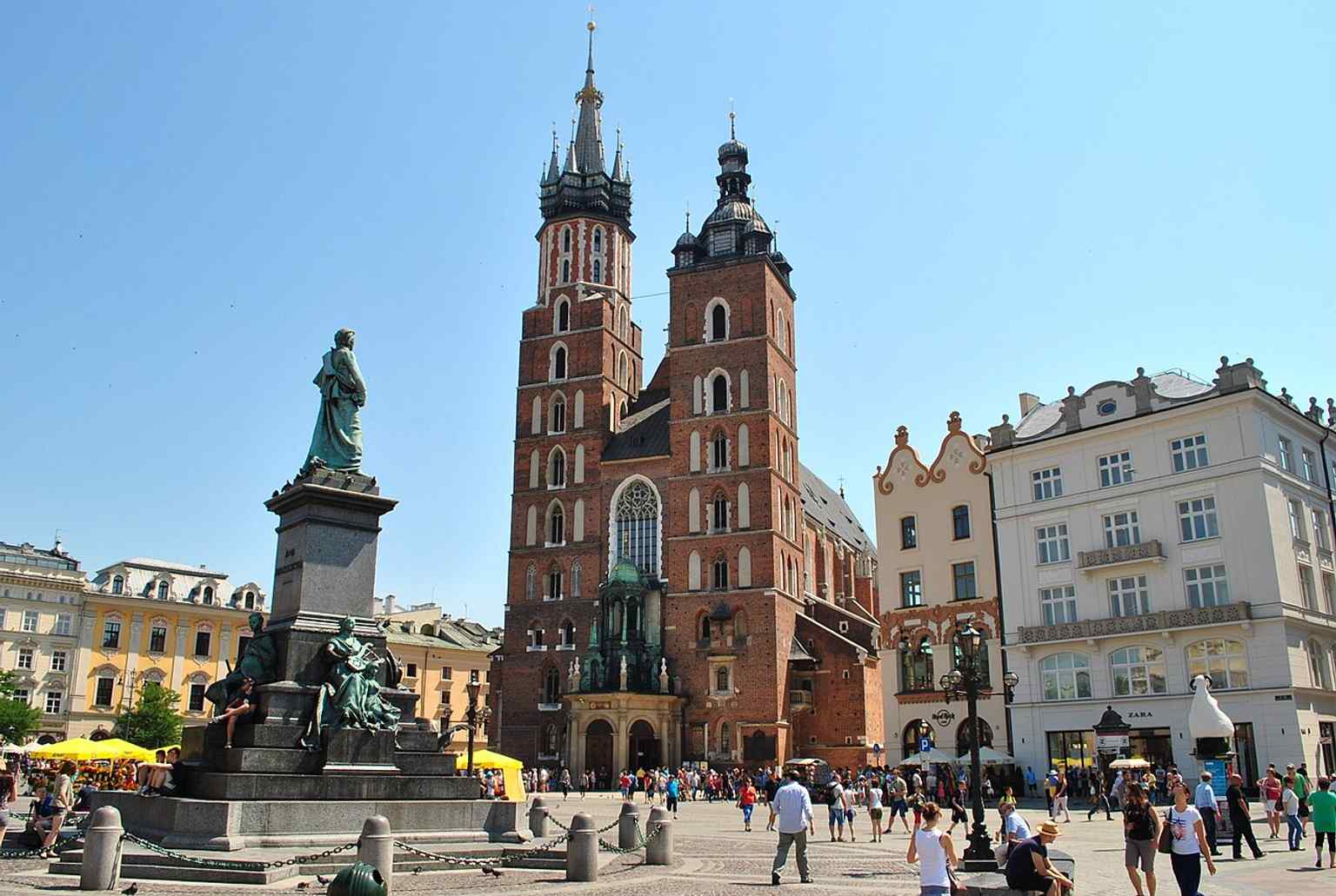 A broader Stare Miasto scene where the basilica appears alongside Kraków’s historic center, useful for context rather than a close architectural detail.
