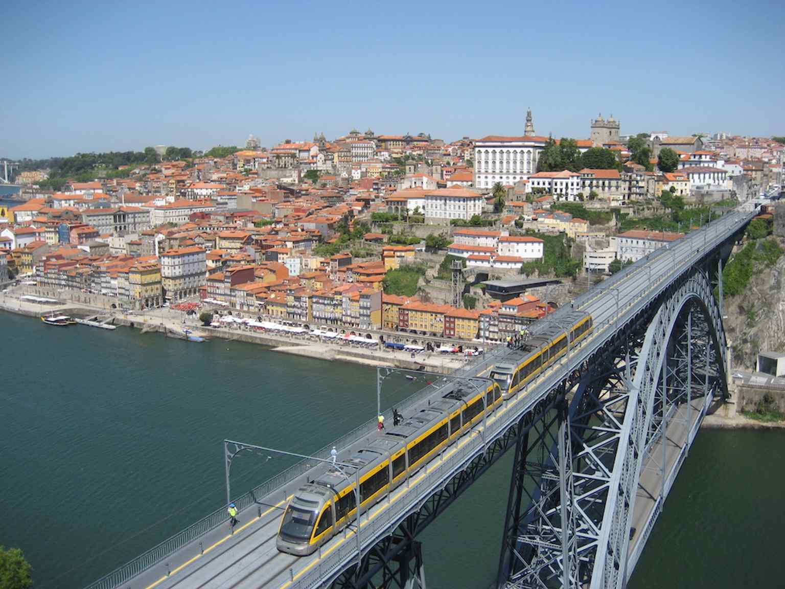 A panoramic view from Serra do Pilar with the bridge spanning the Douro — one of the city’s signature UNESCO-era postcard scenes.