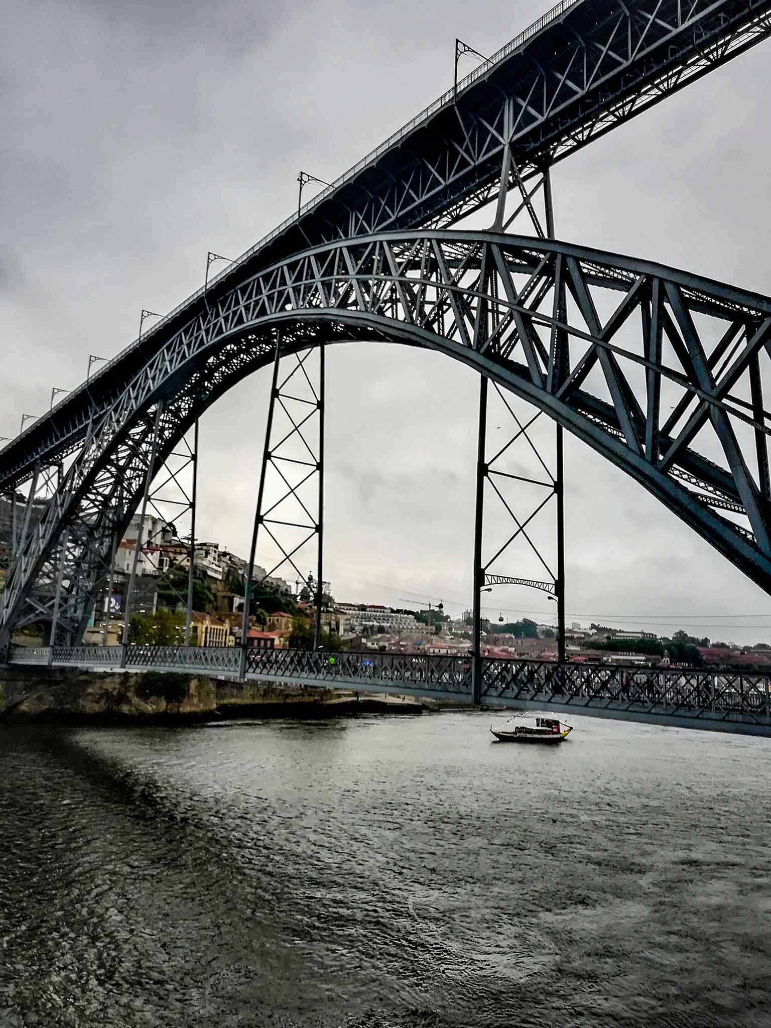 A crisp, close view of the iron bridge structure — useful for showing the metal filigree that replaced the old suspension bridge.
