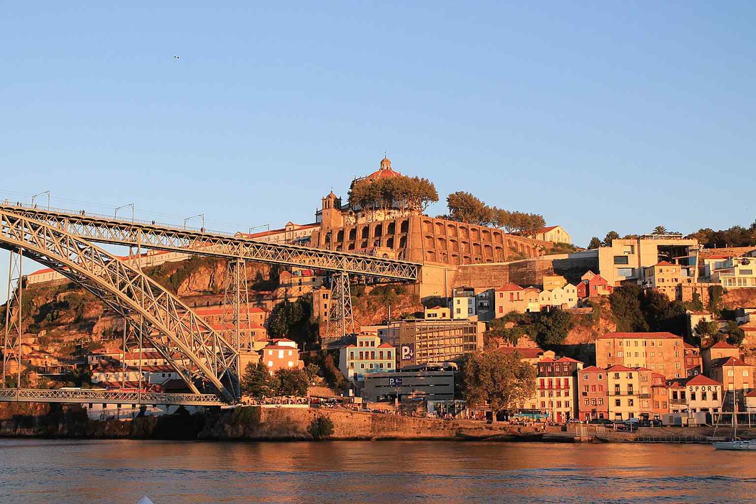A sunset view of the bridge, echoing its long-standing status as one of Porto’s most iconic landmarks since the 19th century.