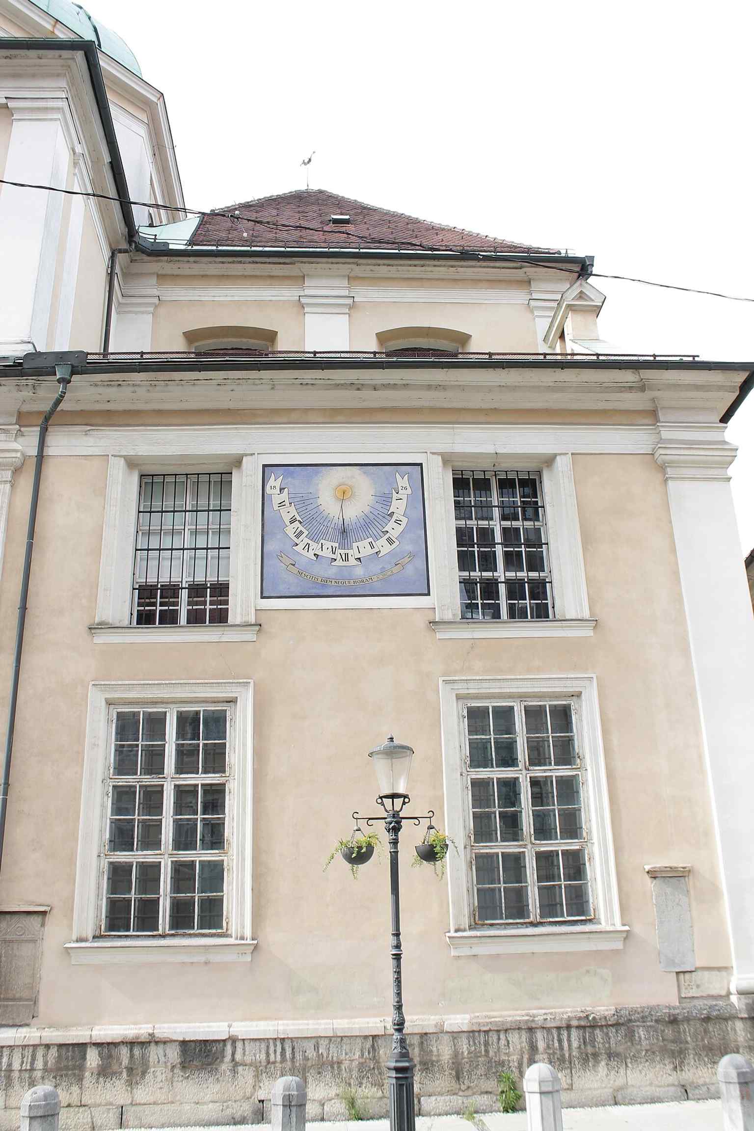 This sundial on the southern facade, dating to 1826, bears the Latin motto 'Nescitis diem neque horam' ('You don't know the day or the hour'), reminding onlookers of life's brevity.