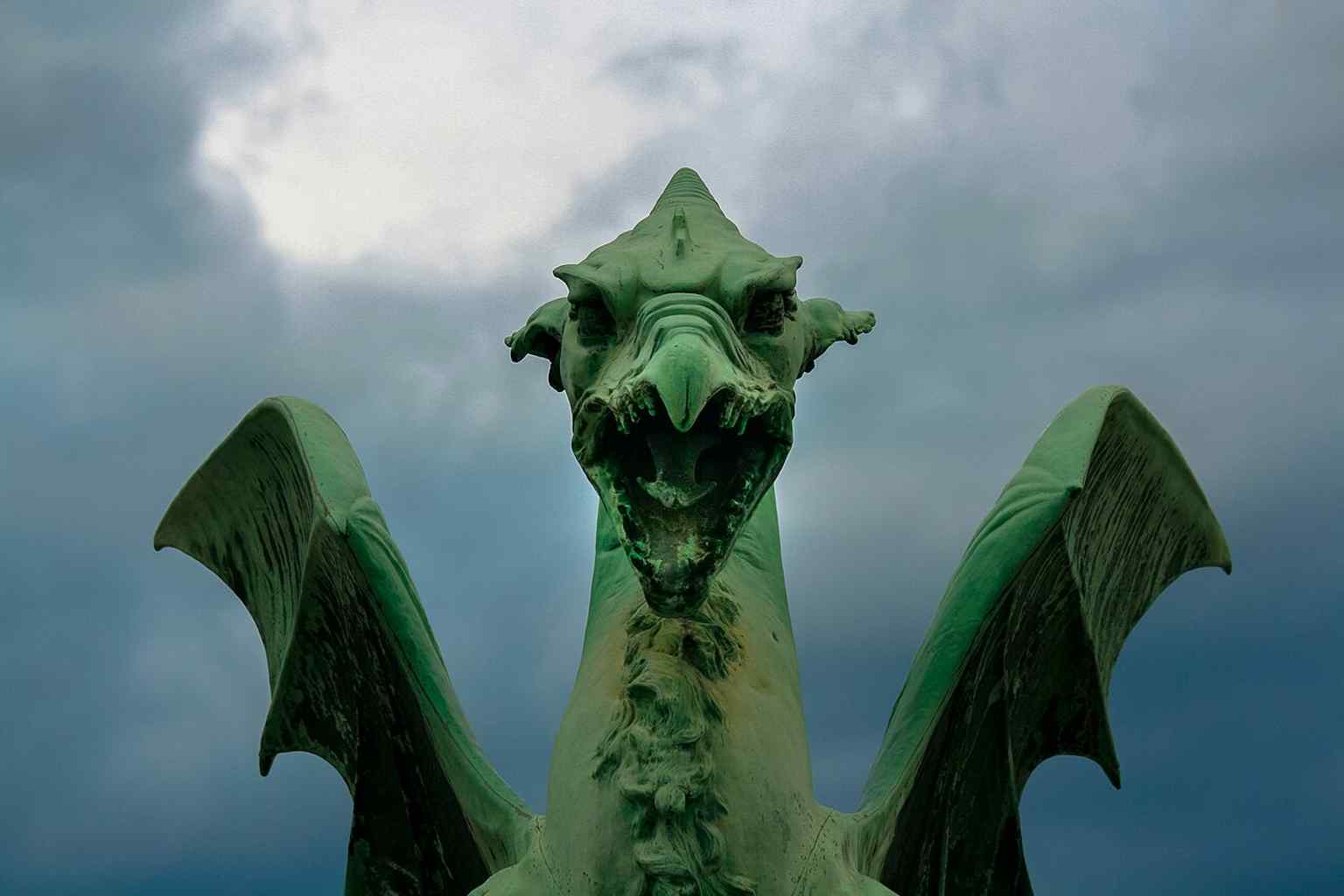 One of the four main copper dragons, weighing 1.5 tons each, adorns the bridge. These dragons developed a deep green patina that Zaninović reportedly anticipated as part of the bridge's evolving aesthetic.