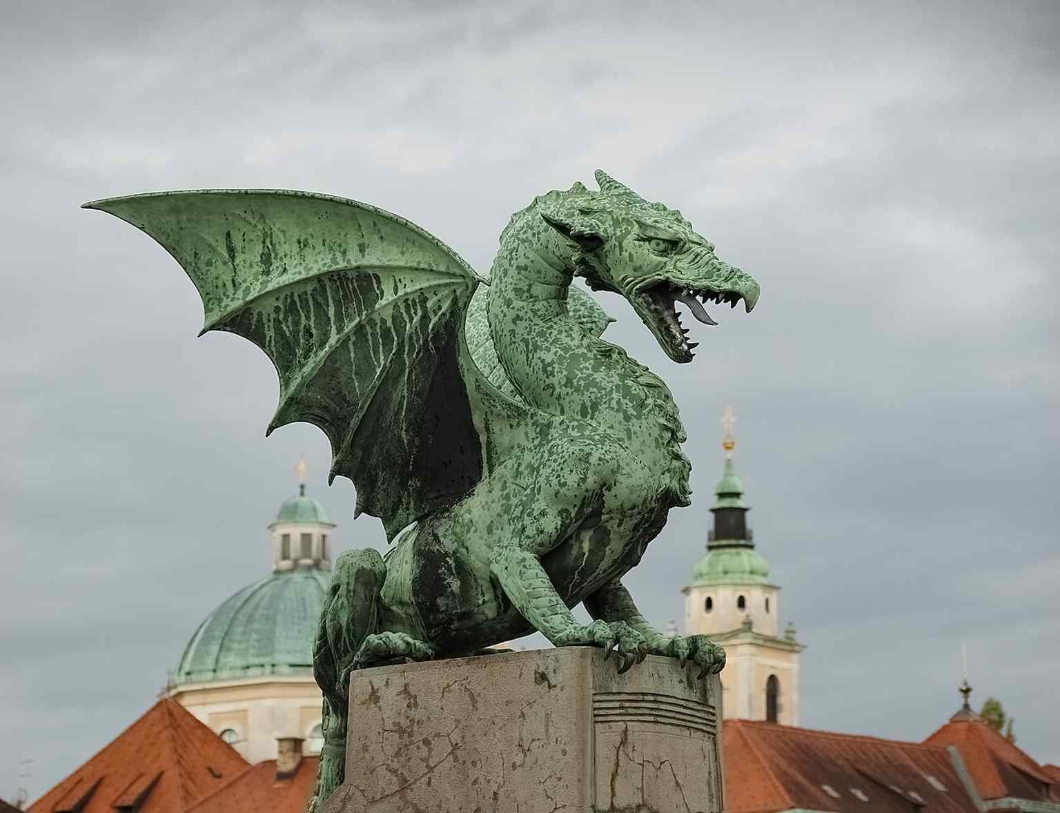 This close-up captures the 'fierce, judging glare' of the dragons, which local legend claims will wag their tails when a virgin crosses the bridge, leading to its cheeky nickname: 'the mother-in-law bridge'.